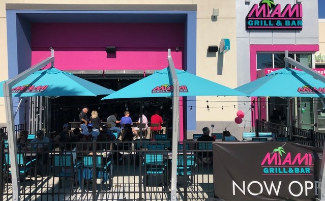 blue canopy on a cantilever parasol with brand printing