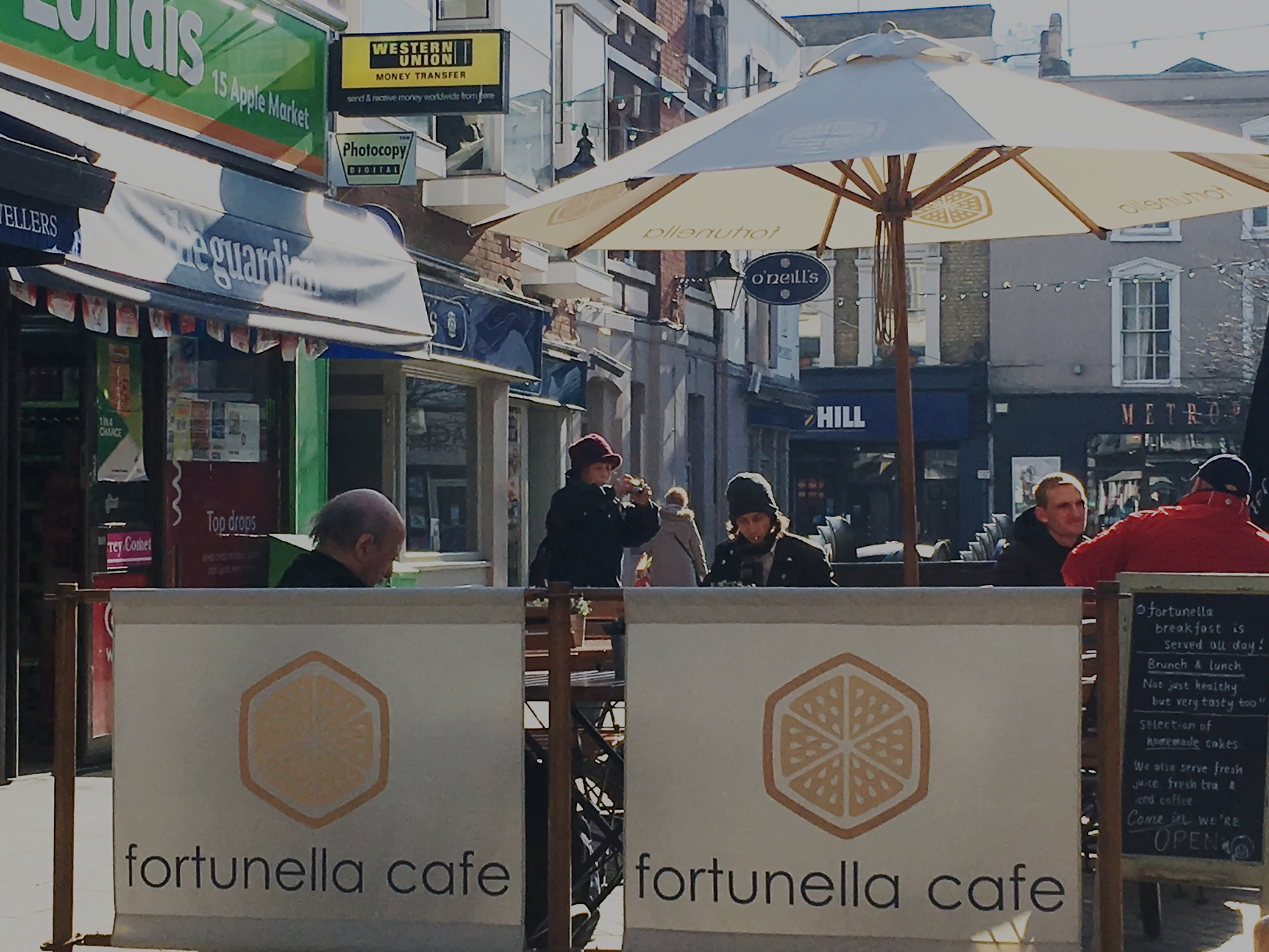 cafe parasols with barries and custom brand printing.