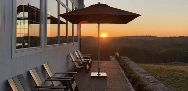 centre-pole parasol on patio with sunset view